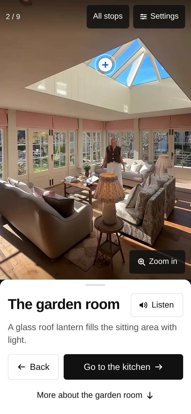 The house tour on a phone, at stop 2: a photo of the garden room, and under it the stop title, the Listen button and the button to walk on to the next stop.